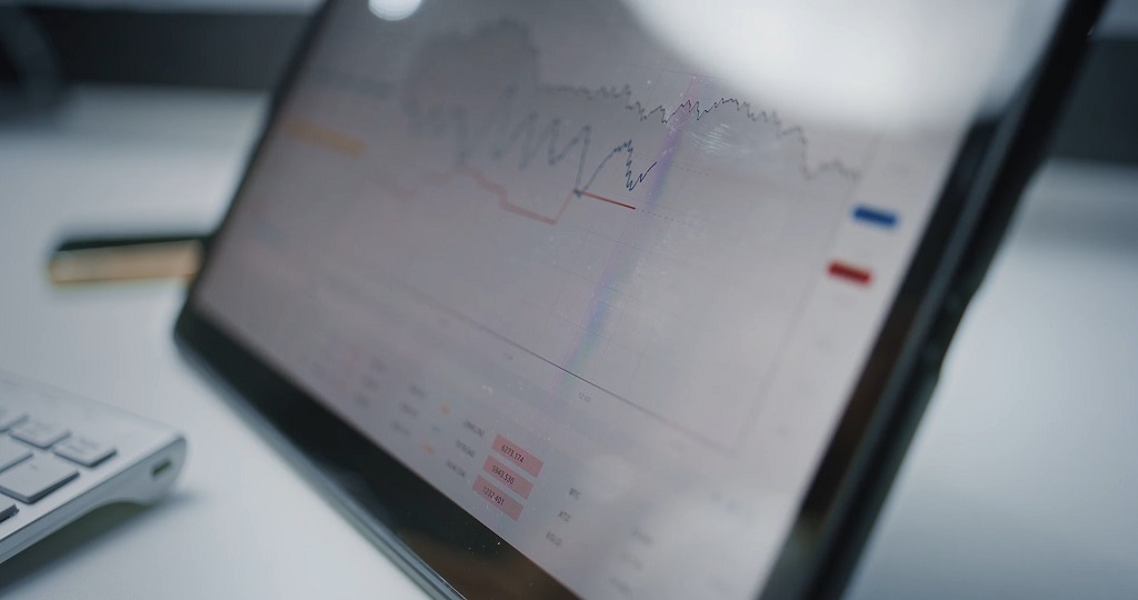 Close-up of a digital analytics dashboard displaying graphs, performance trends, and financial metrics.