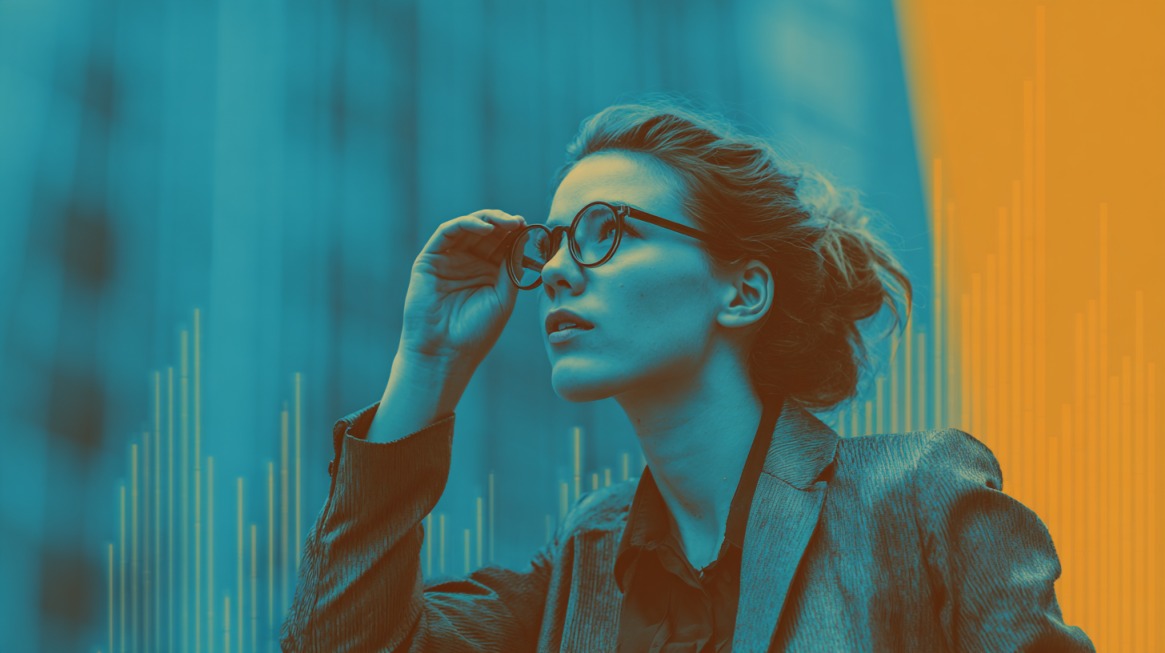 Business professional looking upward with financial chart graphics in the background